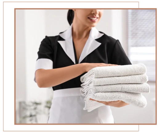 maid folding towels